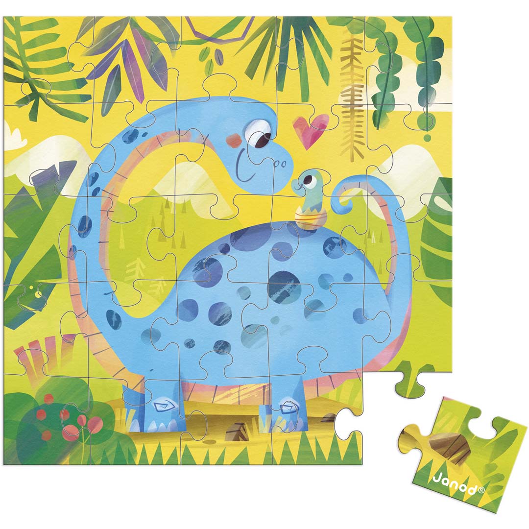 Janod puzzel van een blauwe moederdinosaurus met baby in een jungle-landschap, met twee losse puzzelstukjes.