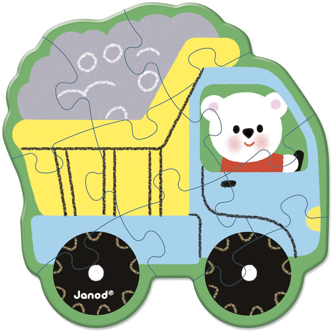 Detail van een Janod kartonnen puzzel van een blauwe kiepwagen met een witte beer als bestuurder.