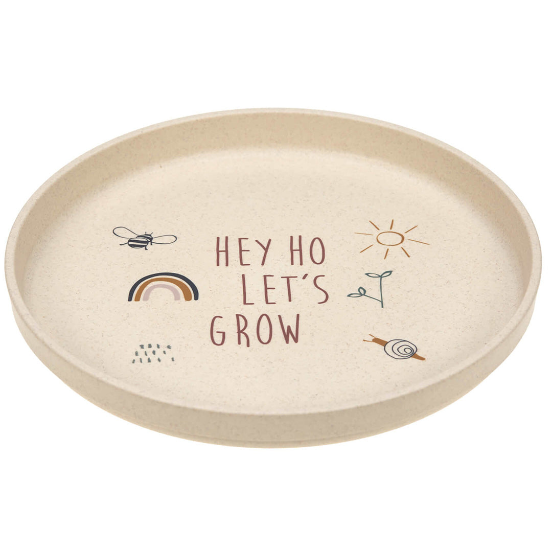 Lässig kinderbord met 'Hey Ho Let's Grow' tekst, bij, regenboog, zon, plant en slak.