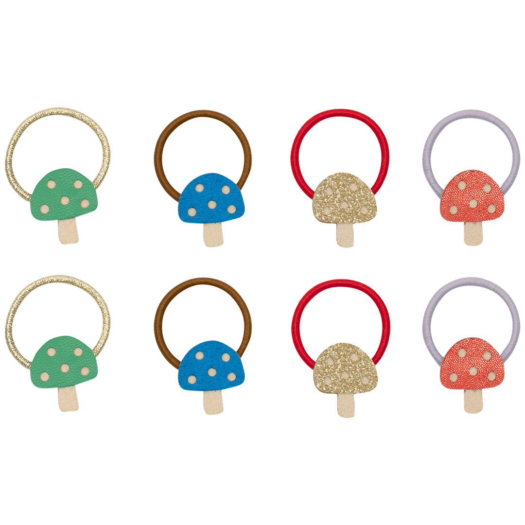 Acht mimi & lula kinderhaarelastiekjes met paddenstoeldecoraties in verschillende kleuren.