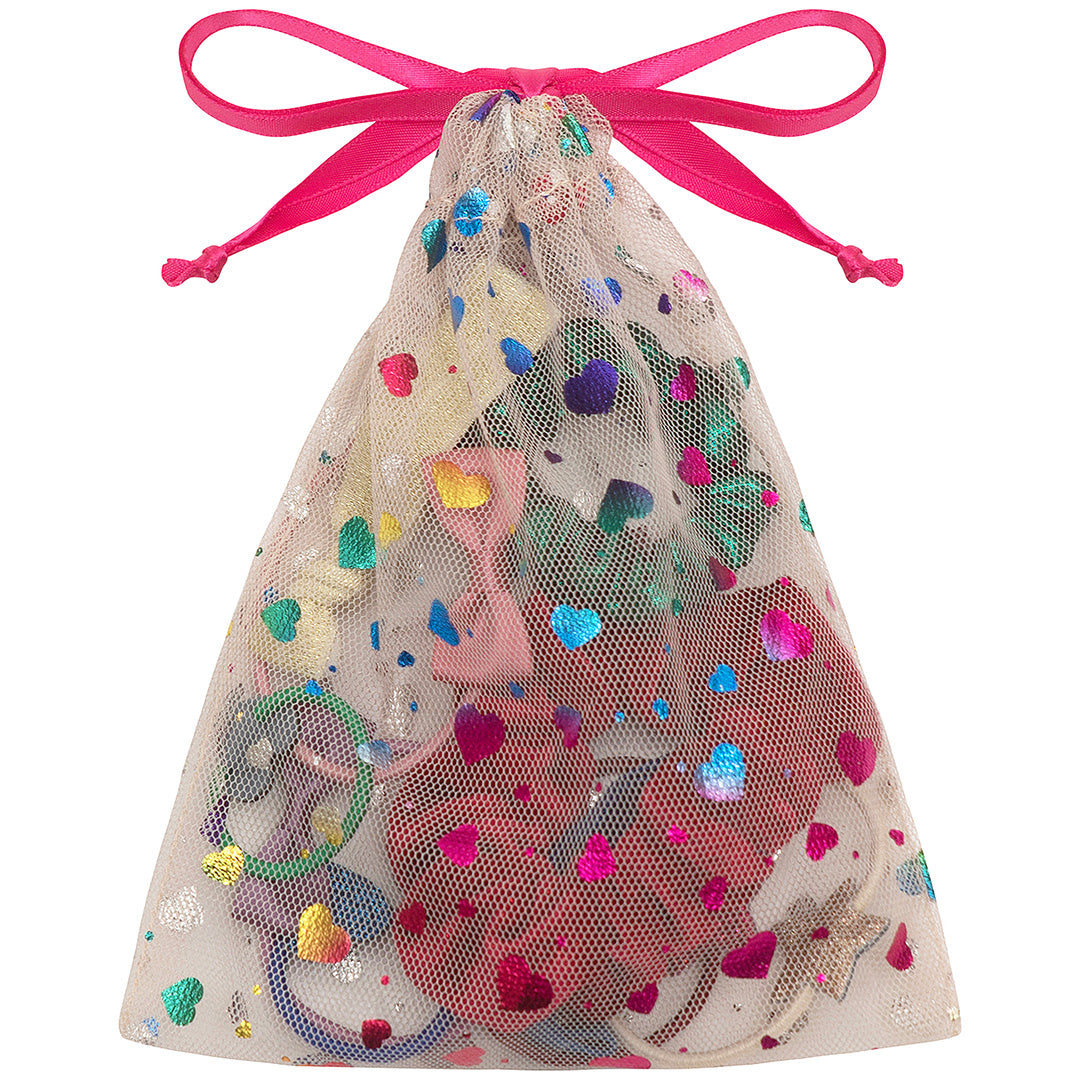 De mimi & lula cadeauset haaraccessoires in een transparant zakje met roze strik en gekleurde harten.