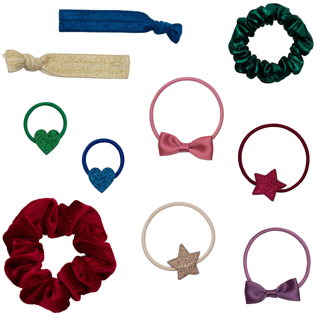 Een verzameling mimi & lula haaraccessoires, waaronder haarelastieken met harten, sterren en strikjes, en scrunchies.