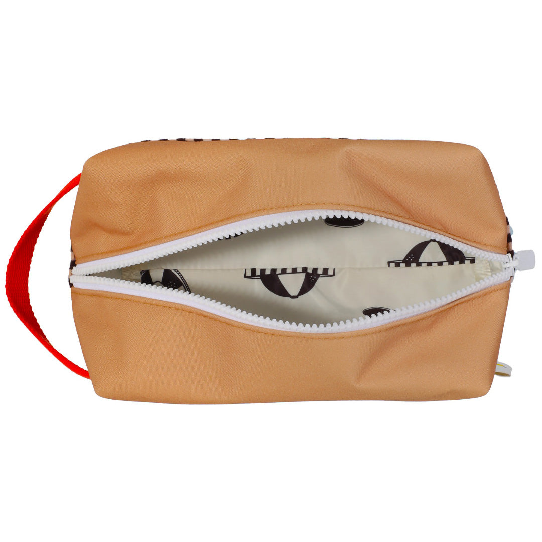 Bovenkant van de open Sticky Lemon colourblocking toilettas met witte rits en patroon aan de binnenkant.
