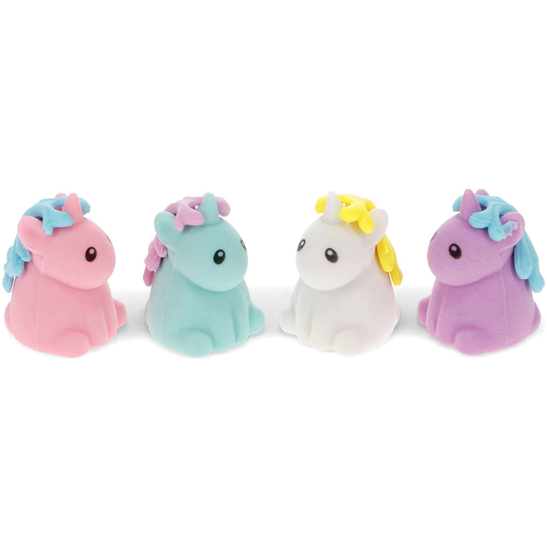 Vier Rex London eenhoorn gummen in roze, blauw, wit en paars.
