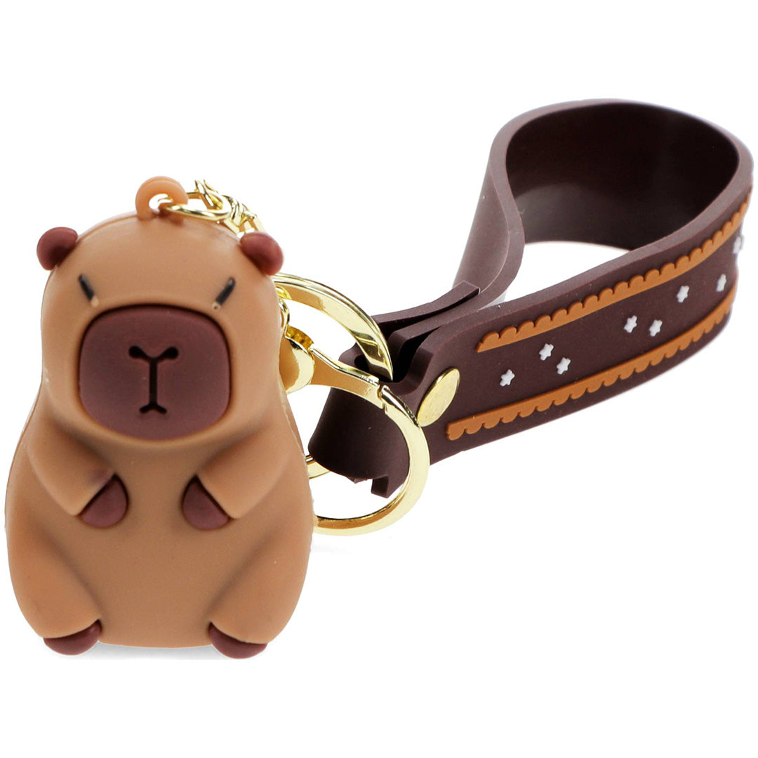 Rex London capybara sleutelhanger met bruine capybara figuur en sterrenband.