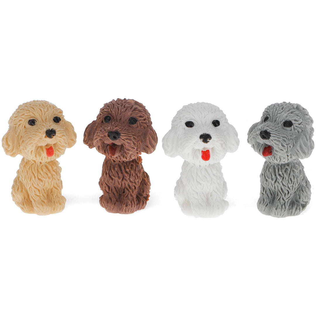 Vier Rex London gummen in de vorm van hondjes in beige, bruin, wit en grijs.