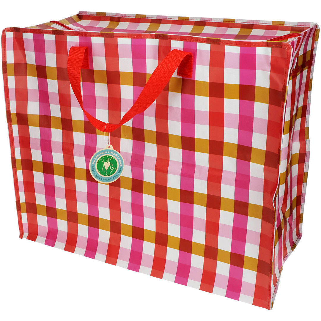 Rex London jumbo opbergtas met roze geruit patroon en rode handvatten.