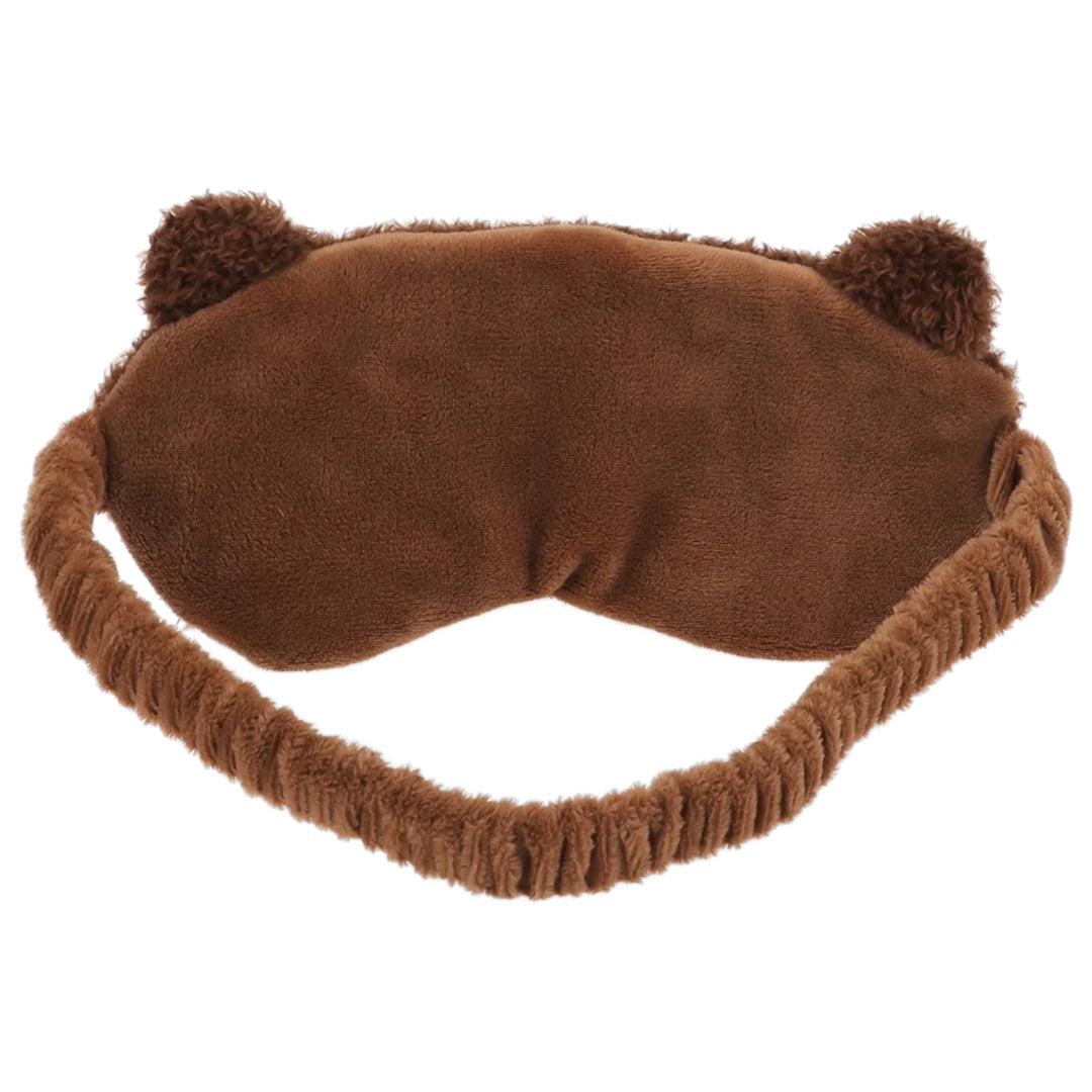 Achterkant van een bruin pluche slaapmasker met elastische band en oortjes.