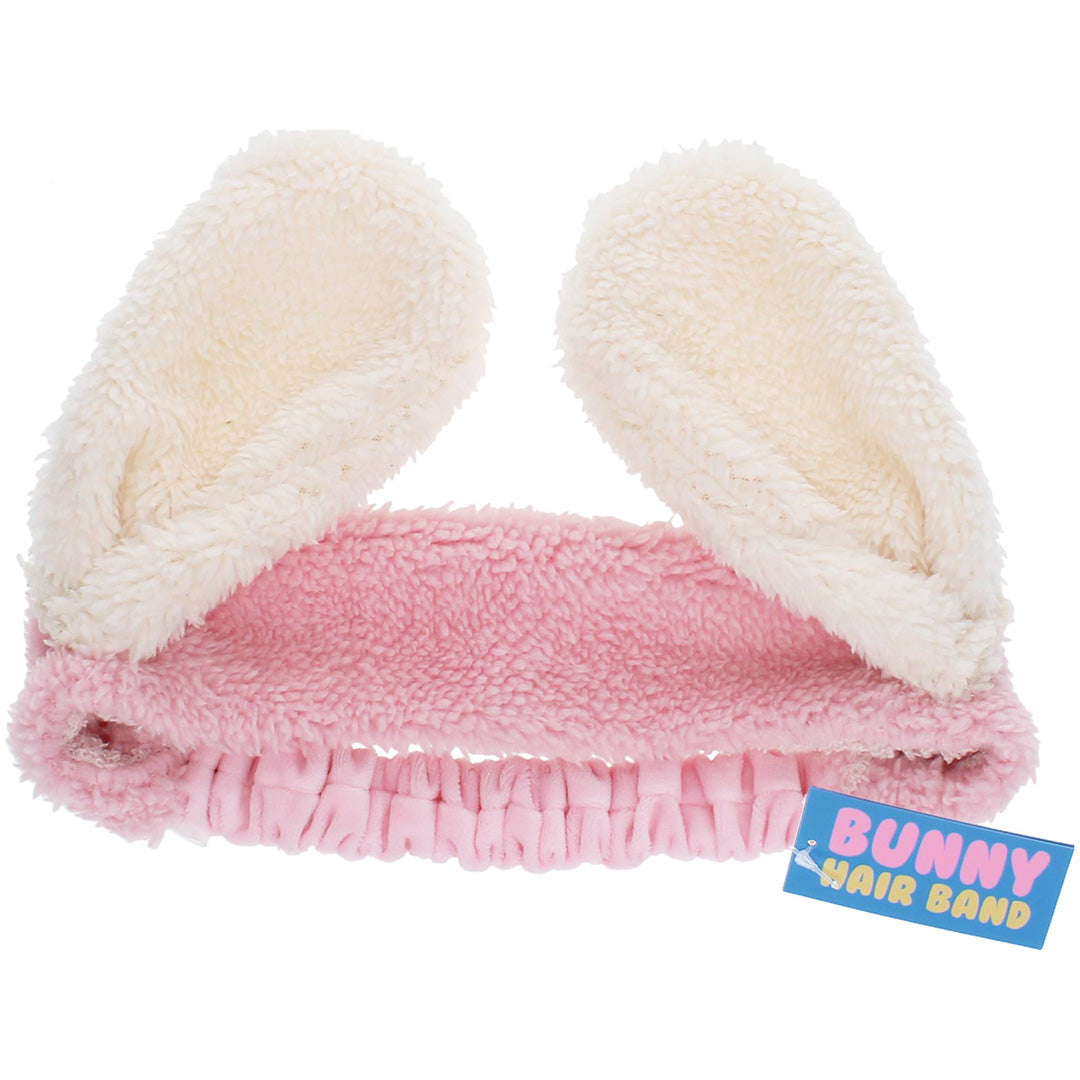 Rex London haarband met roze en crèmekleurige pluizige bunny ears en een blauw label met 'Bunny Hair Band'.