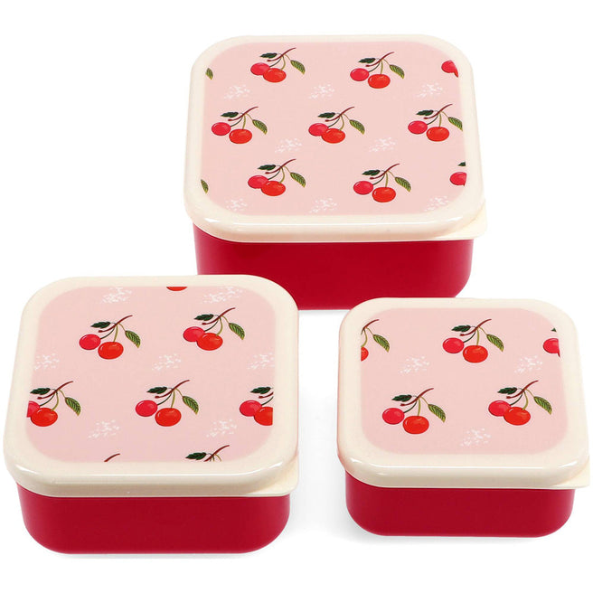 Drie rode Rex London snackdoosjes met kersenpatroon op de deksels.
