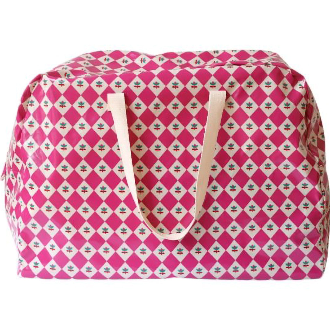 Le petit souk roze jumbo opbergtas met bloemenpatroon en handvatten, van voren gezien.
