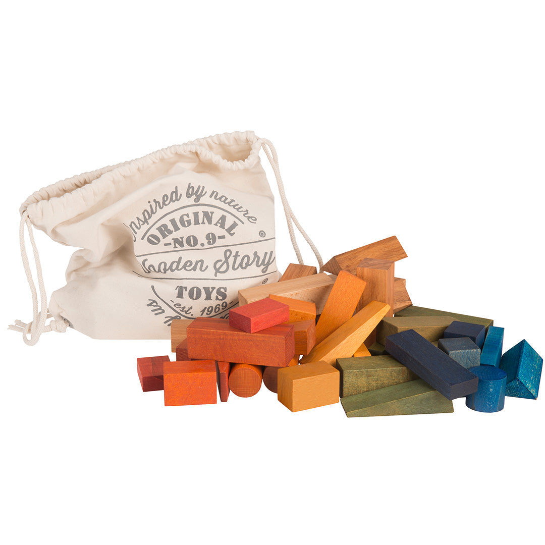 Wooden Story houten bouwblokken in regenboogkleuren met een katoenen opbergzak.