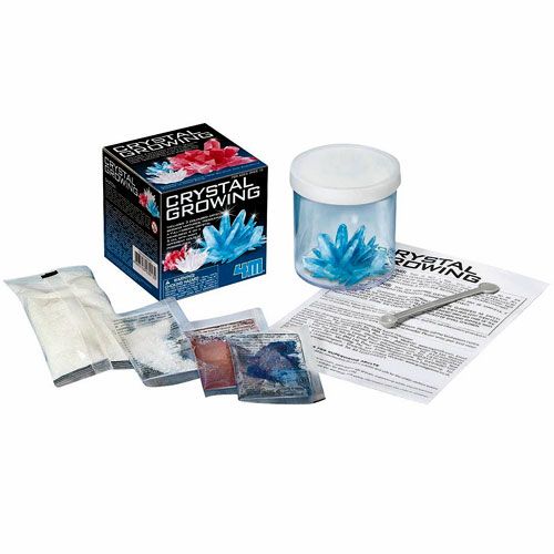 De complete 4M Crystal Growing wetenschapsset met verpakking, potje met kristal, poederzakjes en instructies.