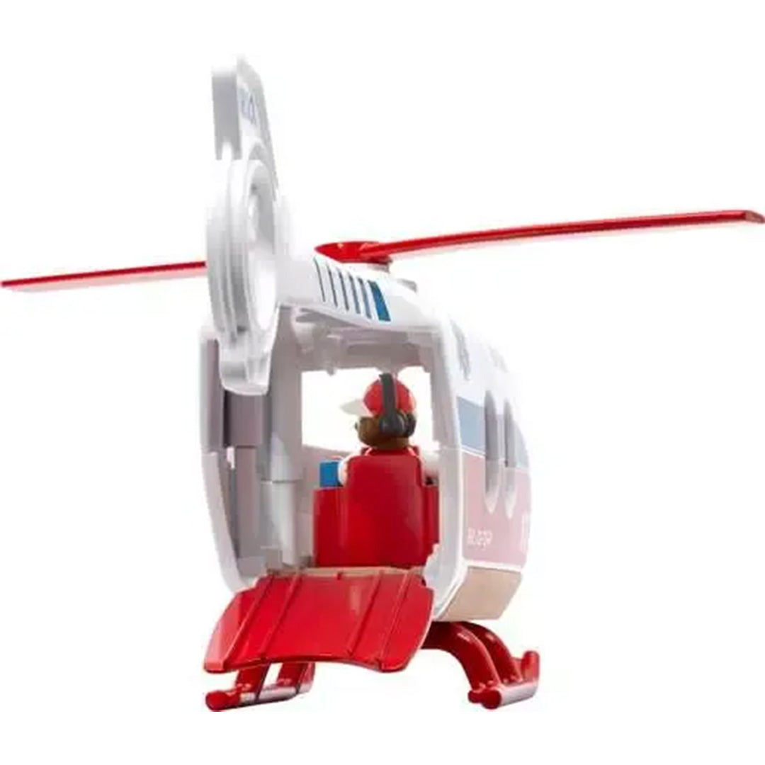Achteraanzicht van de Brio reddingshelikopter met open laadklep en een pilootfiguur in de cockpit.