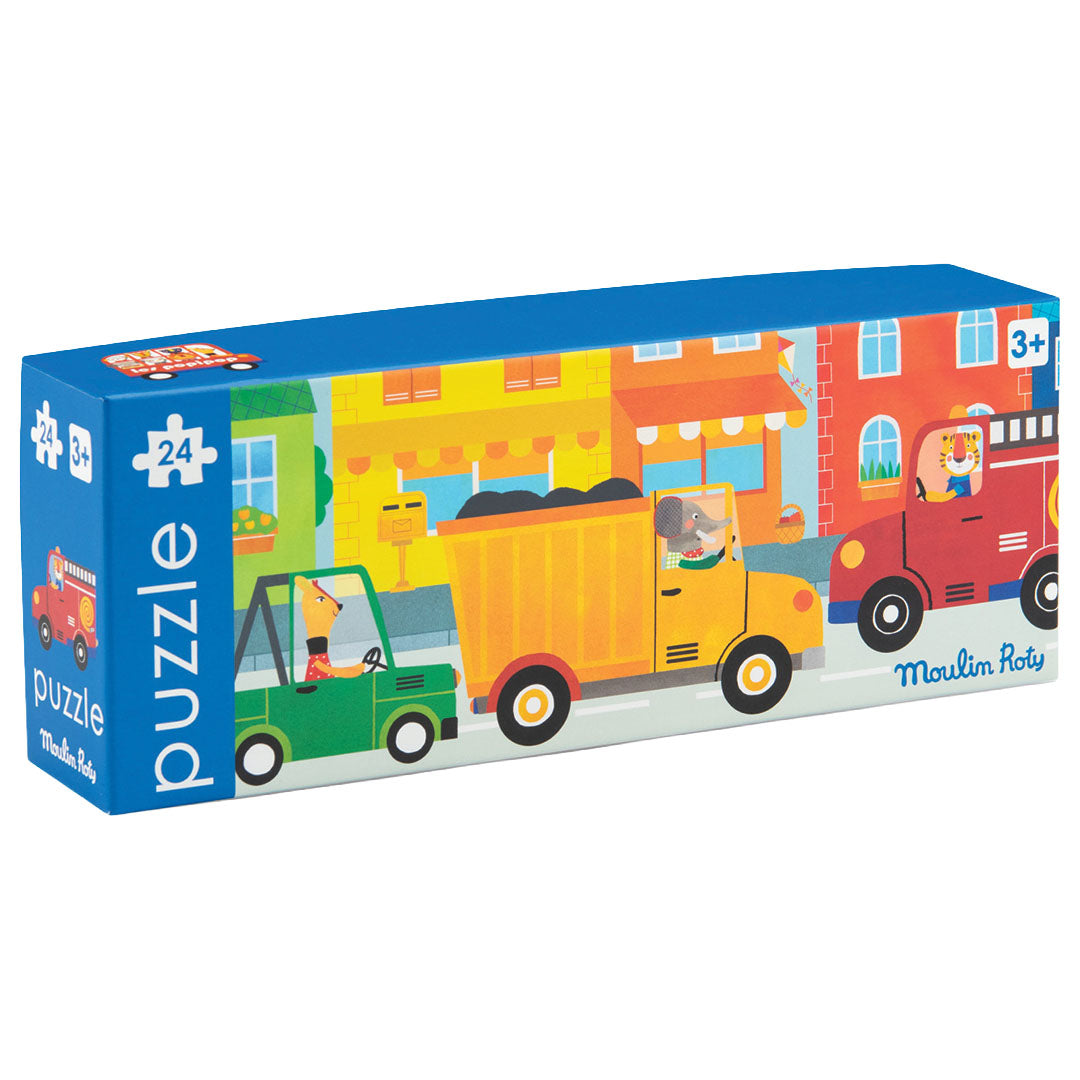 Moulin Roty puzzelverpakking met een illustratie van diverse voertuigen in een straat.