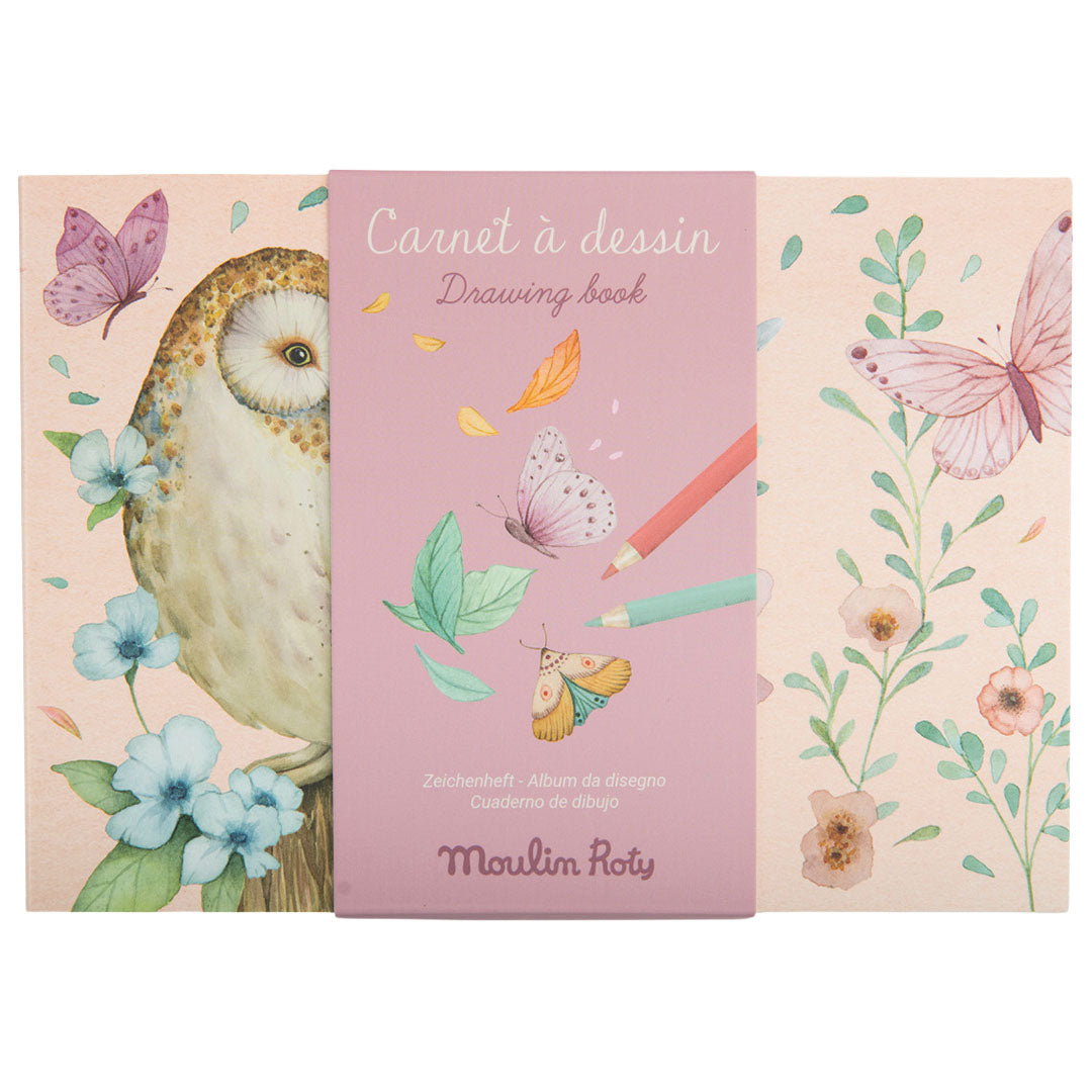 Roze Moulin Roty schetsboek met een uil, vlinders en bloemen op de voorkant.