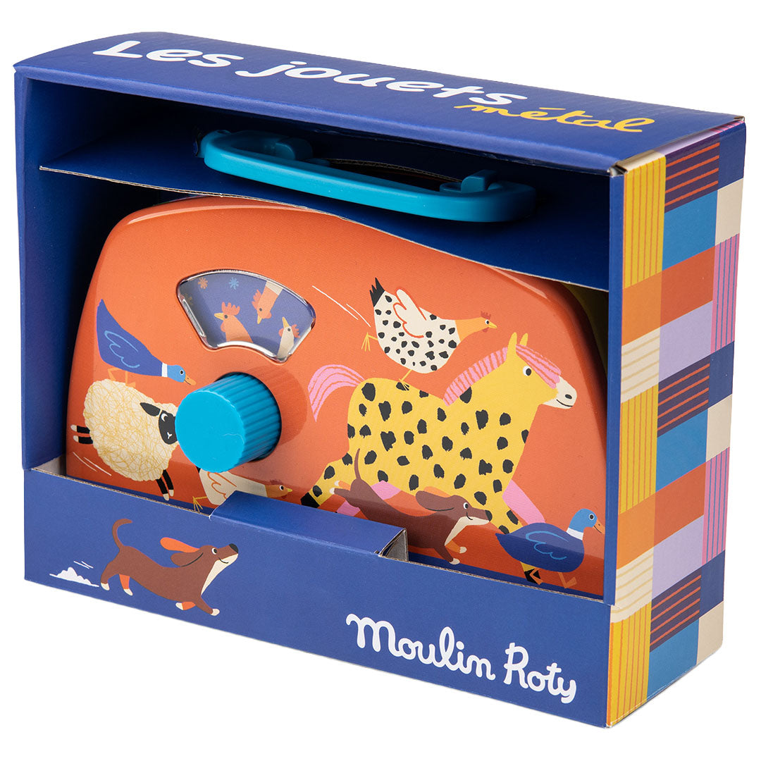 Verpakking van de Moulin Roty oranje muziekdoos radio met boerderijdieren.