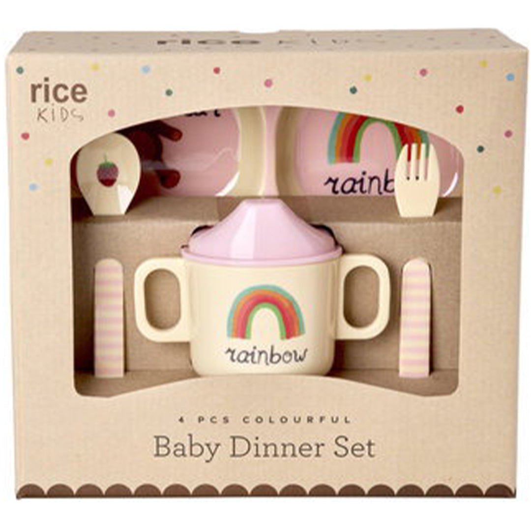 De verpakking van het roze rice kinderservies met regenboog- en dierenpatronen.