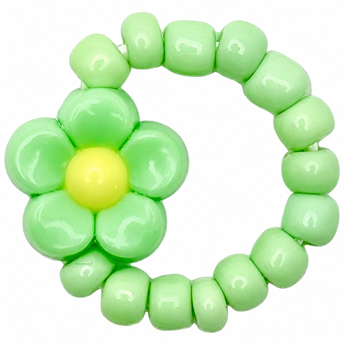 Ratatam kinderring van groene kralen met een bloem.