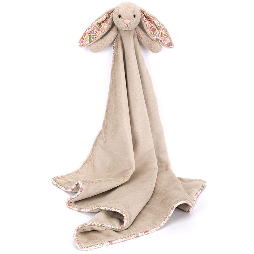 Jellycat knuffeldekentje met een beige konijn en uitgevouwen deken met bloemenpatroon aan de randen.