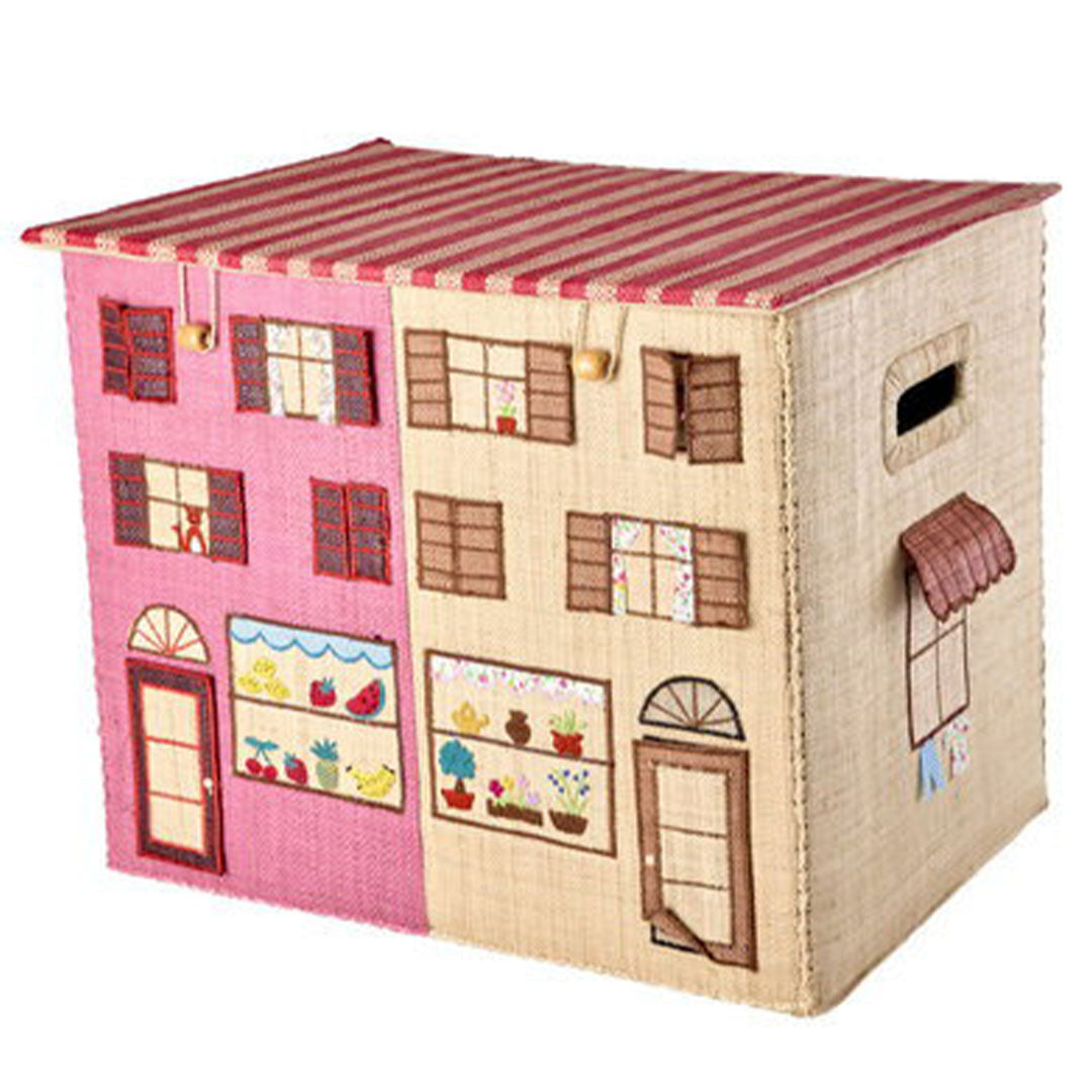Rice opbergmand met Parijs thema in de vorm van een roze en beige huis met ramen, deuren en een gestreept dak, van de zijkant gezien.