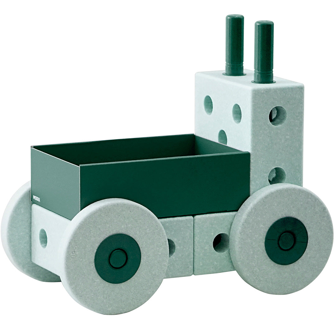 Modu loopwagen 3-in-1 in de vorm van een mintgroen voertuig met donkergroene bak en wielen.