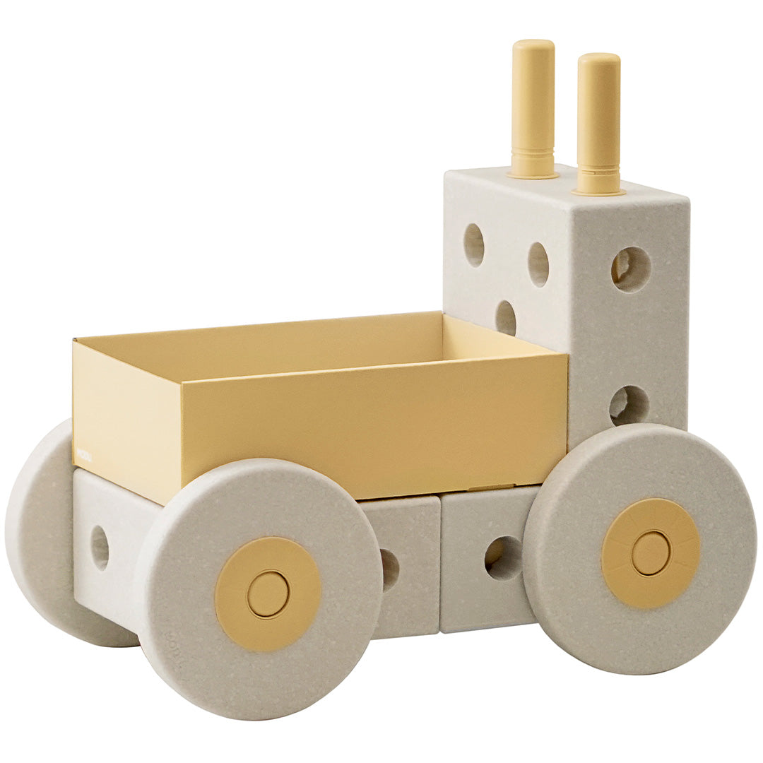Modu 3-in-1 loopwagen in zandgrijs en geel, geassembleerd als voertuig.