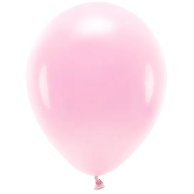 Een opgeblazen partydeco lichtroze ballon.