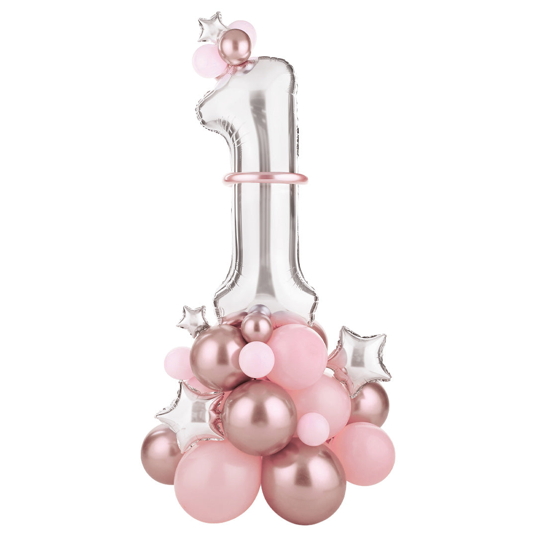 Partydeco ballonkit voor een eerste verjaardag met een zilveren cijfer 1 en roze en roségouden ballonnen.