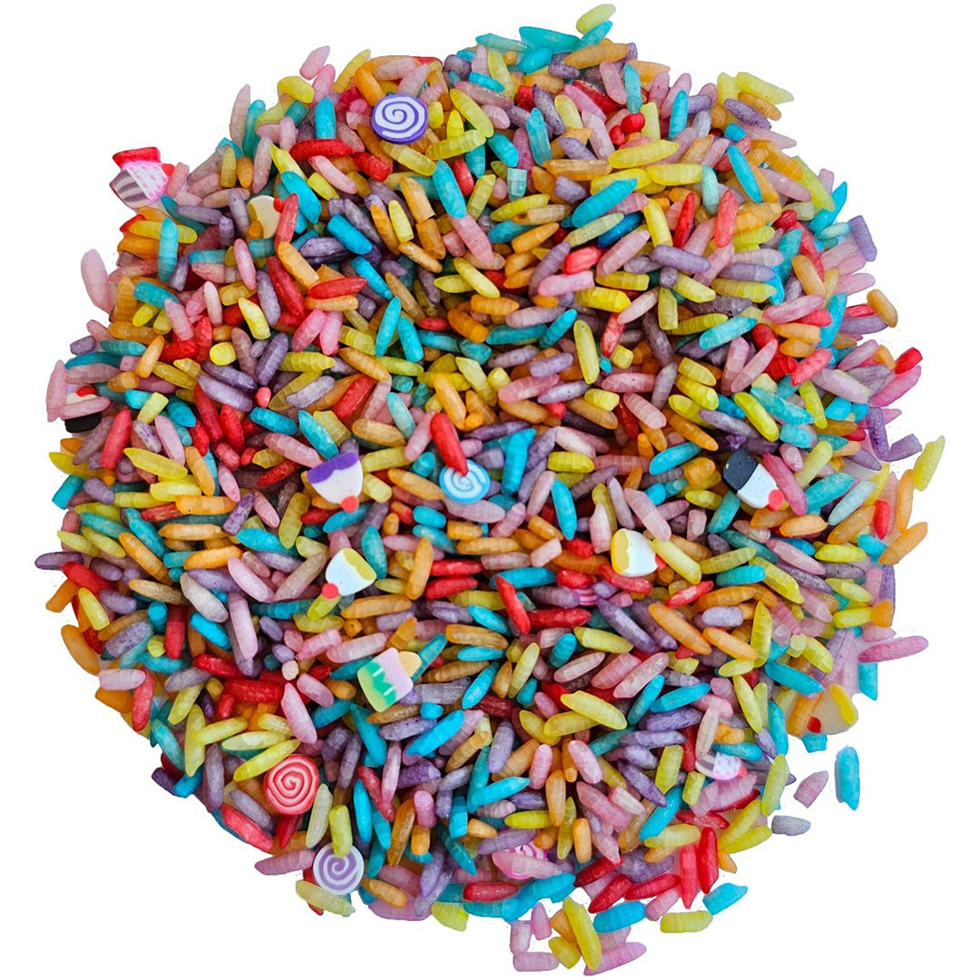 Grennn sensorisch speelgoed: een hoopje veelkleurige speelrijst met snoepjes-sprinkles.
