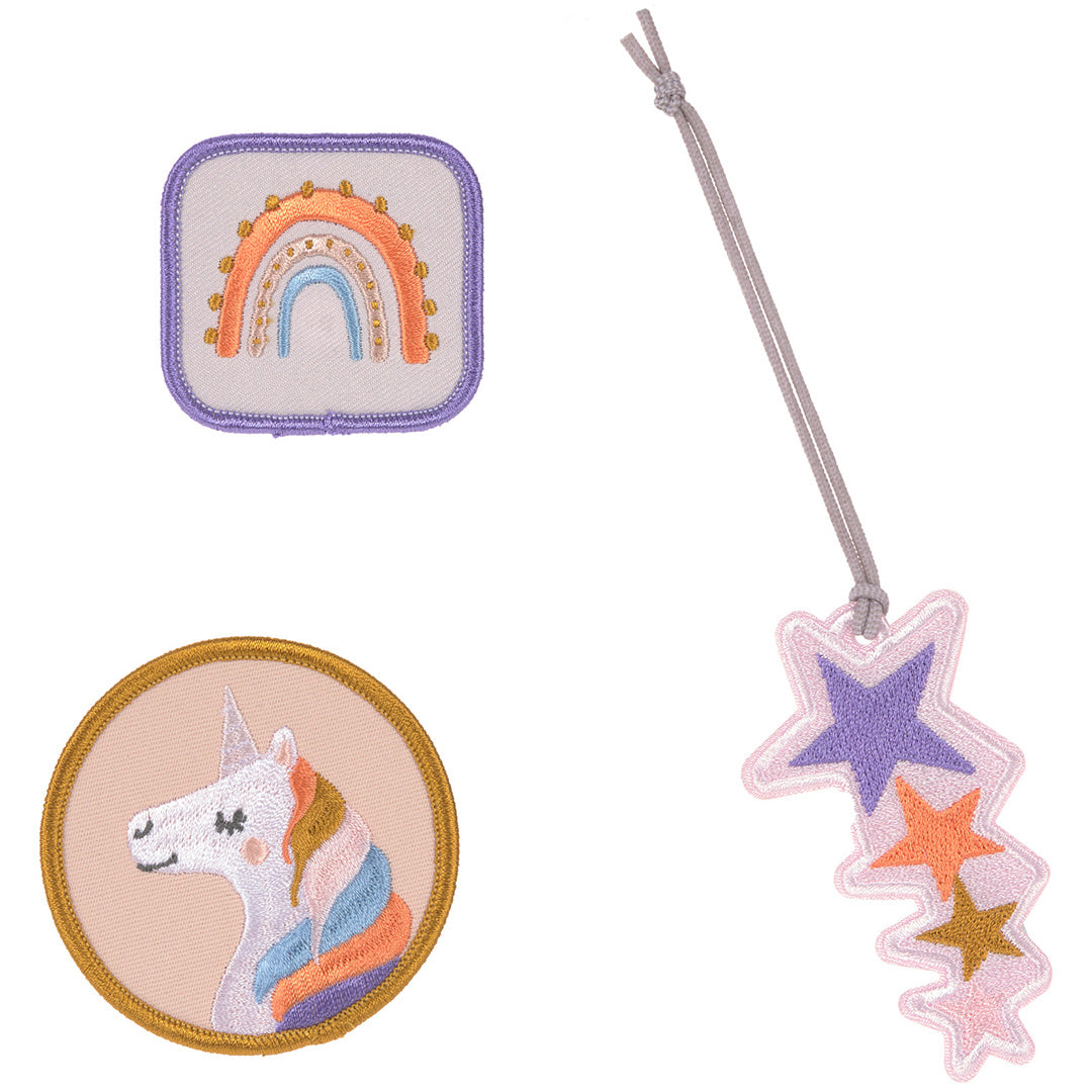 Drie Lässig patches: een ronde eenhoorn, een vierkante regenboog en een sterrenhanger.