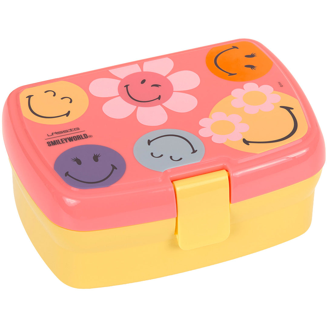 Lässig broodtrommel voor kinderen in roze en geel met SmileyWorld gezichten en bloemen op de deksel.