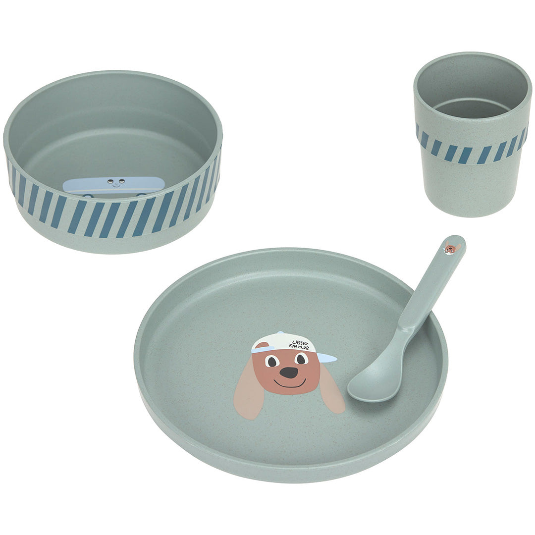 Lässig babyserviesset met groene kom, bord met hondenfiguur, beker en lepel.