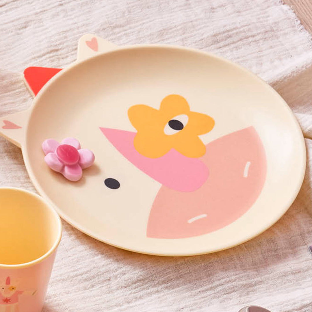 rice kinderbord met eenhoorn design en roze bloemdecoratie.