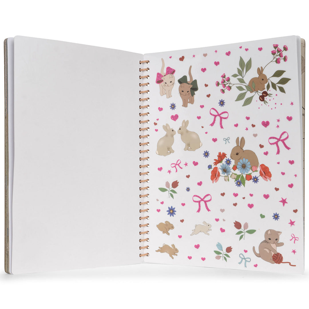 Een open stickerboek met een pagina vol stickers van konijnen, katten, bloemen en hartjes.