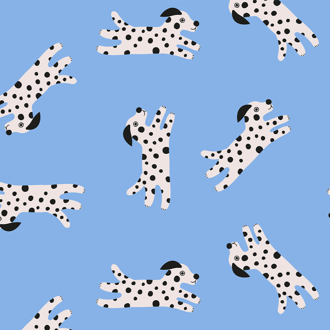 ole inpakpapier met een patroon van vrolijke dalmatiër honden op een blauwe achtergrond.