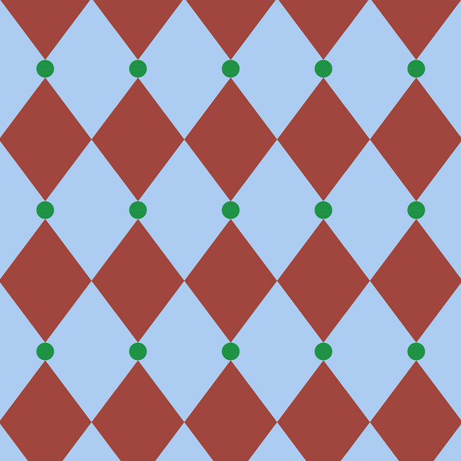 ole inpakpapier met een patroon van rode diamanten en groene stippen op een lichtblauwe achtergrond.