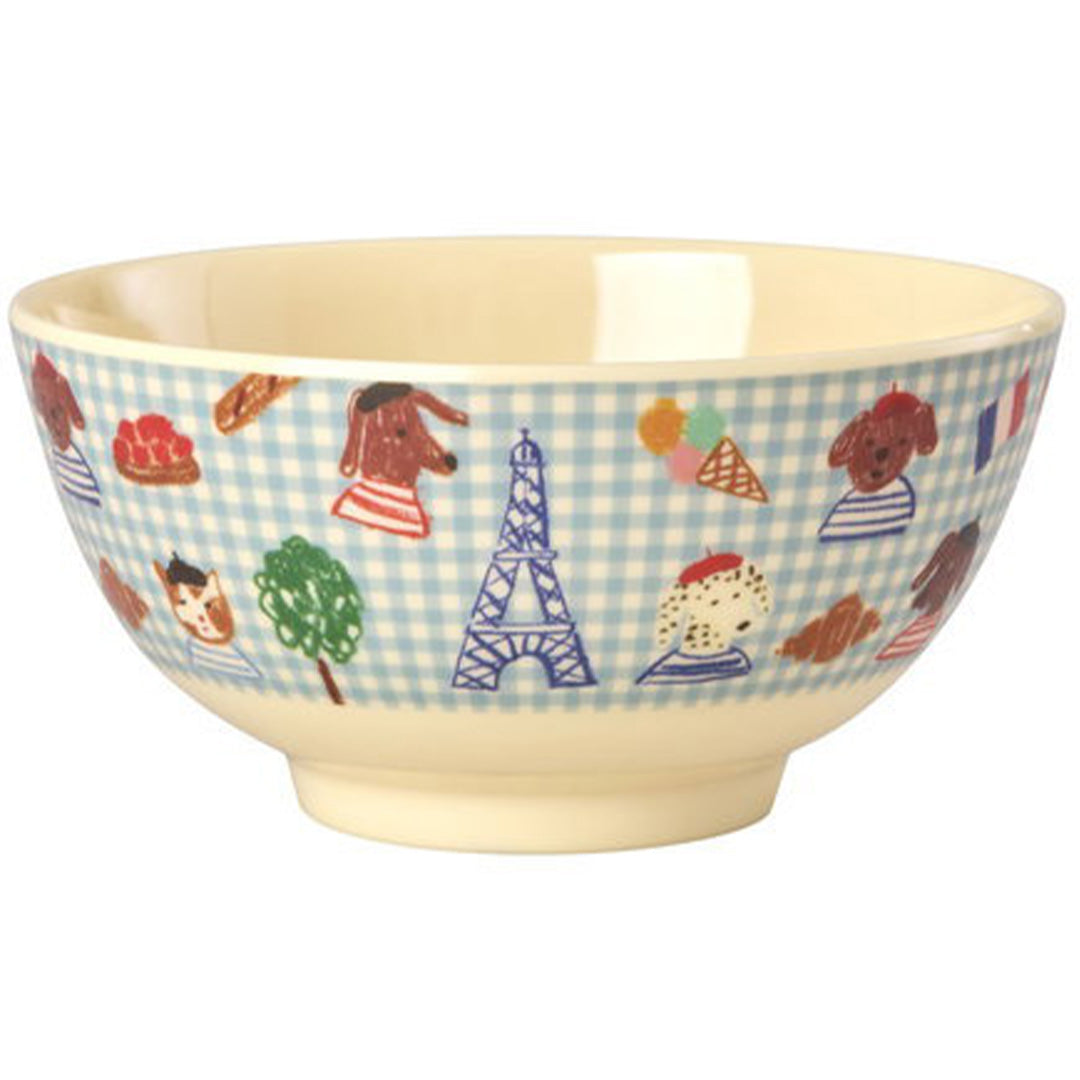 Rice kinderkom van melamine met blauw geruit patroon en illustraties van honden, de Eiffeltoren en Franse lekkernijen.