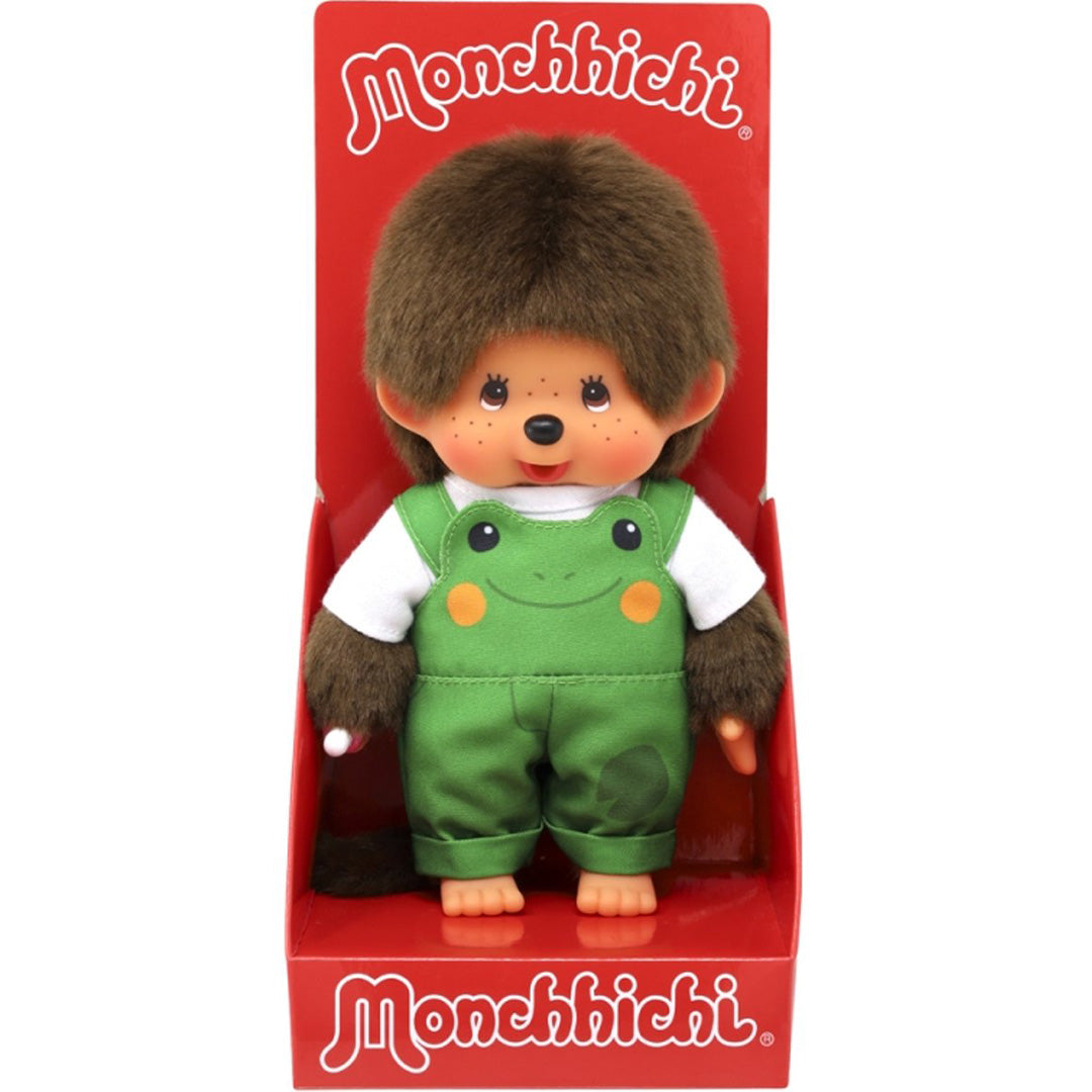 Monchhichi pop jongen met groene kikker tuinbroek in de rode productverpakking.