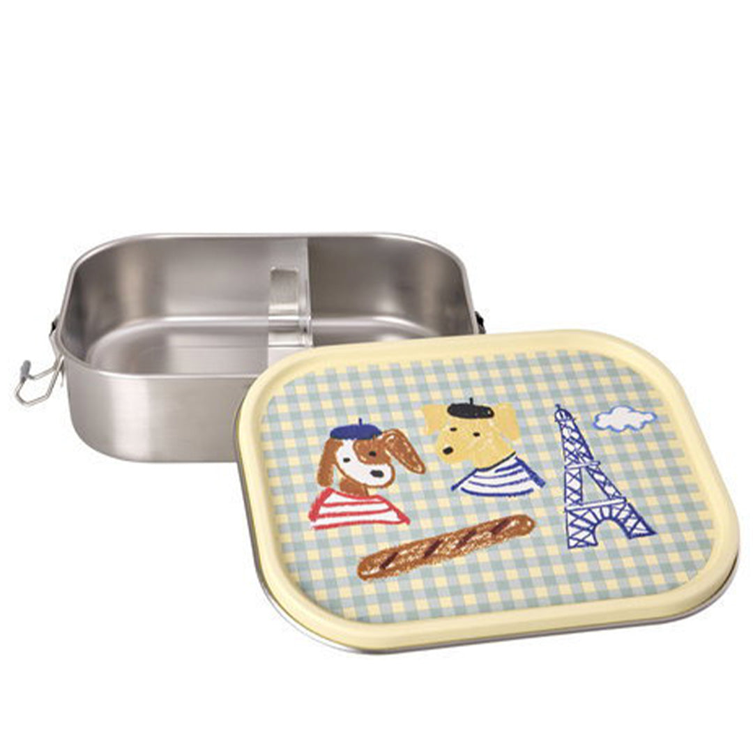 Open rice rvs broodtrommel voor kinderen met een Parijs-thema op de deksel, inclusief honden, stokbrood en Eiffeltoren.