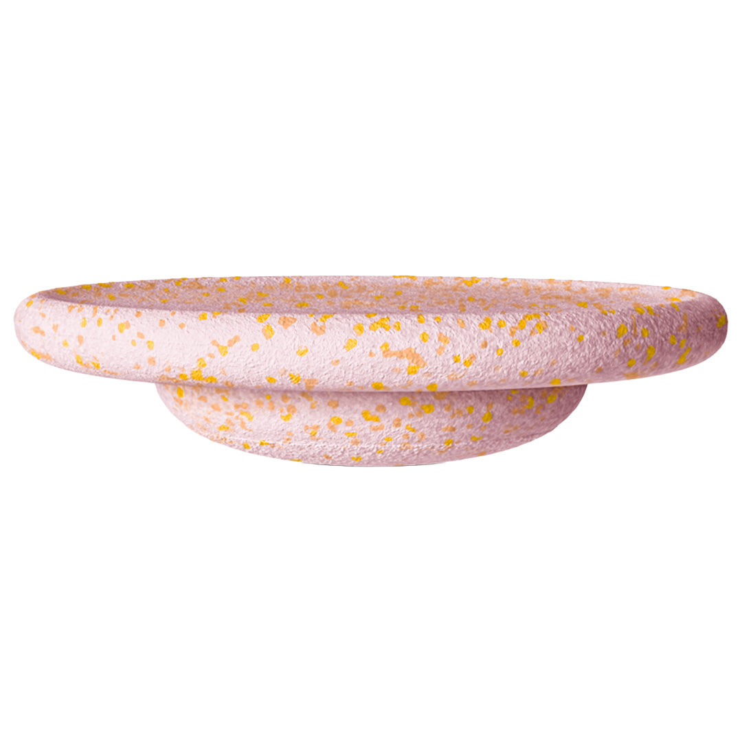 Stapelstein balance board in roze met gele stippen.