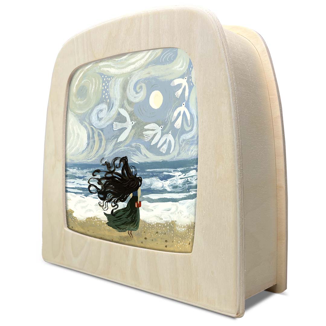 Schuin vooraanzicht van de Toverlux toverplaat 'Het Tij' met een houten frame en een illustratie van een meisje op het strand.