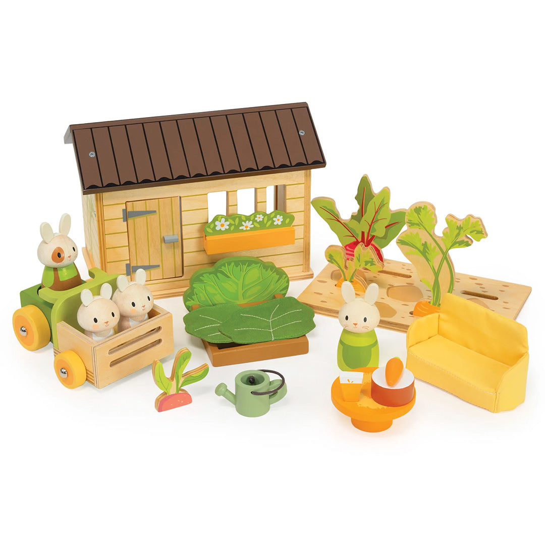 Tender Leaf Toys konijnen moestuin speelset met houten schuur, konijnenfiguren, tractor en moestuinaccessoires.