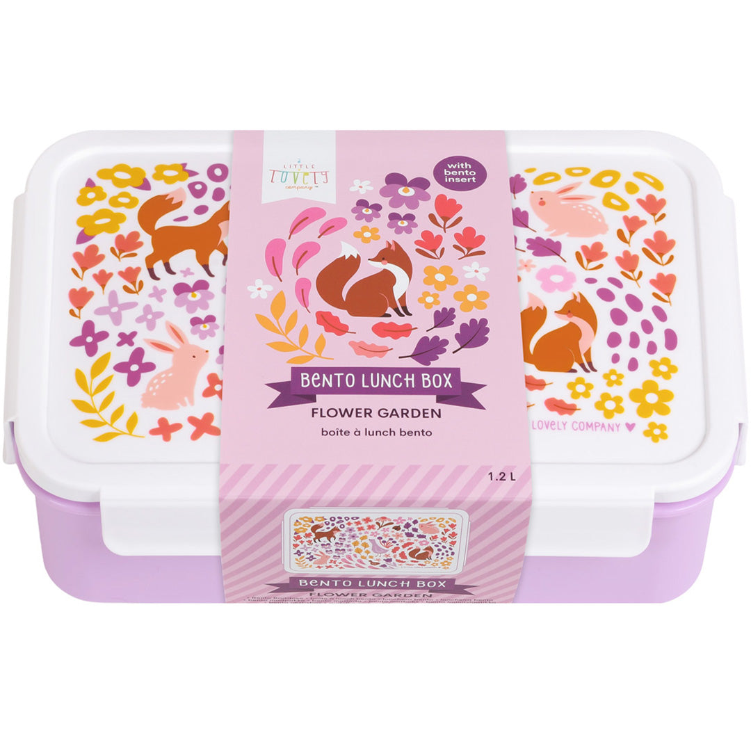 De verpakking van de A Little Lovely Company bento broodtrommel met bloemen- en dierenpatroon.