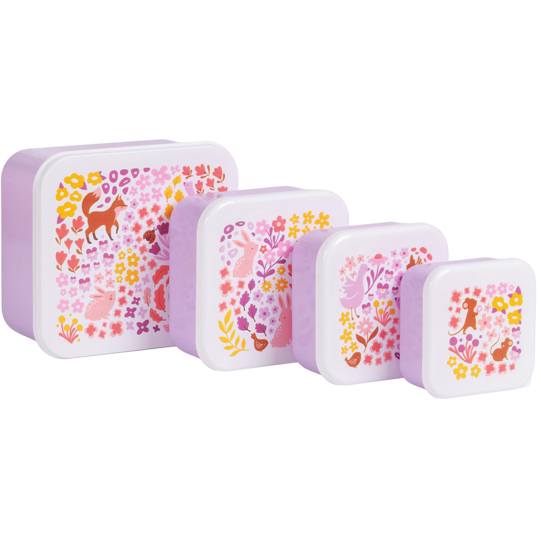 Vier paarse A Little Lovely Company lunchboxen met bloemen- en dierenpatroon op de deksels, van groot naar klein.