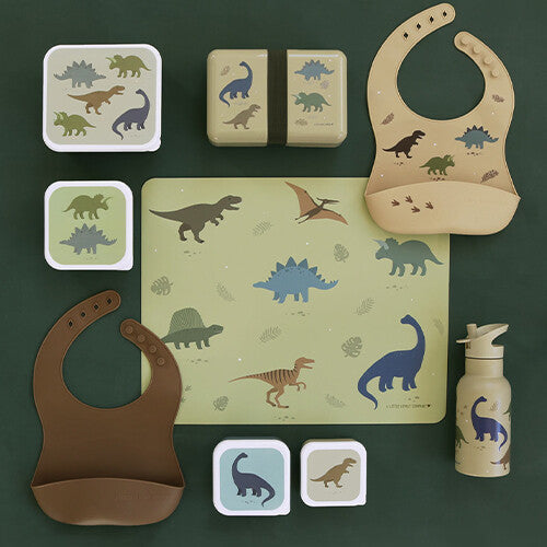 A Little Lovely Company collectie van placemat, lunchboxen, slabbetjes en drinkfles met dinosaurusthema.