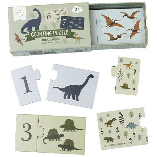 a little lovely company telpuzzel met dinosaurussen, met de open doos en losse puzzelstukken met nummers en dino's.