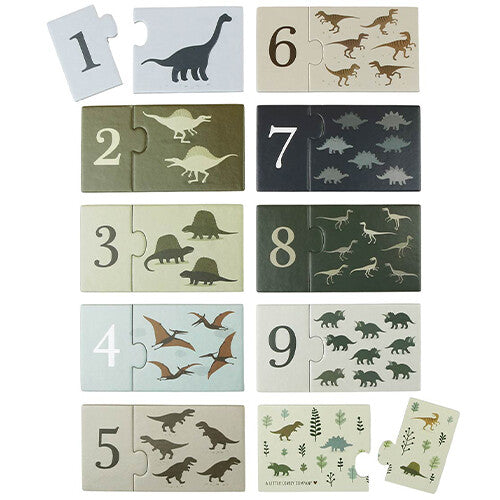 Alle puzzelstukken van de dinosaurussen telpuzzel, met nummers 1 tot en met 9 en bijbehorende aantallen dino's.