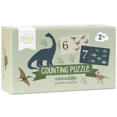 De gesloten verpakking van de a little lovely company telpuzzel met dinosaurussen.