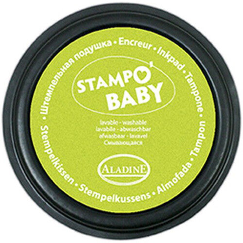 Detailfoto van het ronde, zwarte Aladine Stampo Baby stempelkussen met een felgroen, afwasbaar inktvlak.